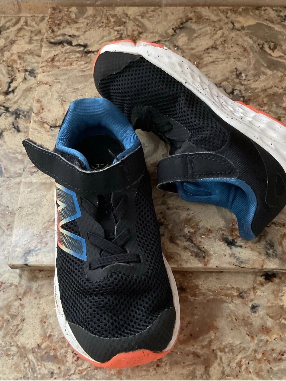 New Balance Kids Black Sneakers with Blue Lining and Coral Accent
